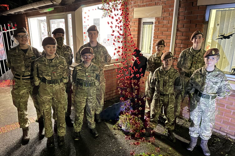 The young Crediton Army Cadets who created the Remembrance display at the Crediton Cadet Centre with Staff Sgt Tina Vaughan-Atkins, left.  AQ 5986