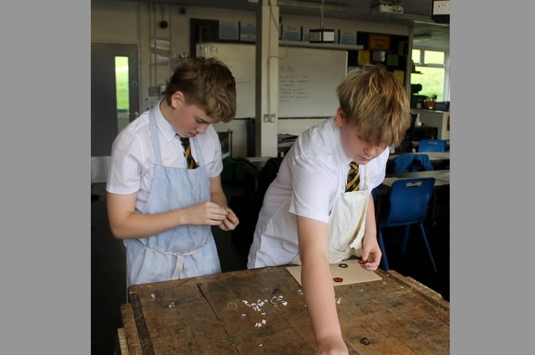 QE Year 10 Design and Technology students making the acrylic poppies.