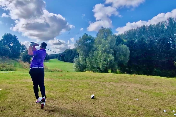 Ollie driving off on the long and picturesque 14th hole at Downes Crediton. 
