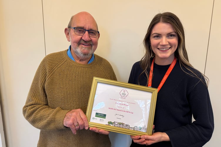 Bert Jewell and Crediton Town Council Assistant Clerk Emma Anderson with the Silver Gilt Award won by Crediton at the South West in Bloom Awards. AQ 7184