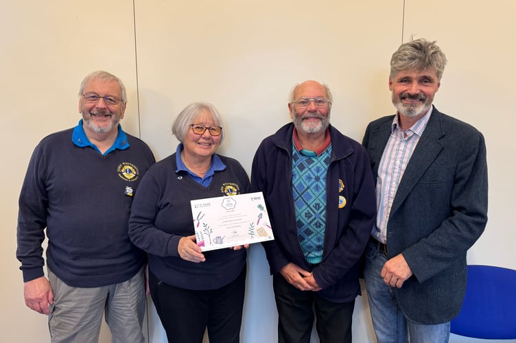 Crediton and District Lions Club received a Level 5 It’s Your Neighbourhood Outstanding certificate from Crediton Town Councillor Giles Fawssett. AQ 7219