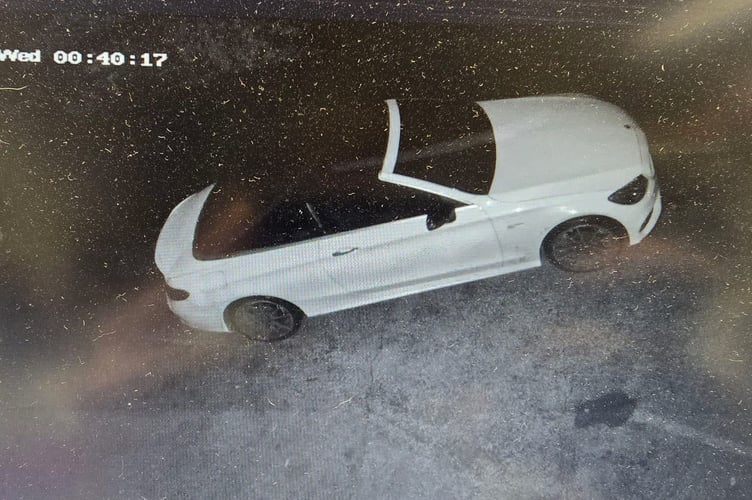 The distinctive white Mercedes convertible.
