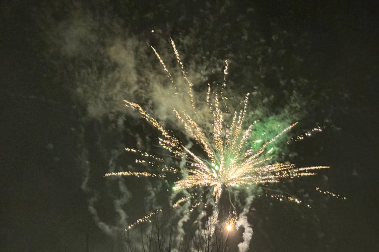 One of the fireworks rising over Crediton. AQ 7419