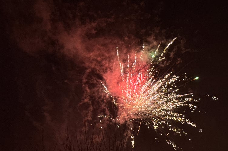 Fireworks rising high above Crediton. AQ 7423