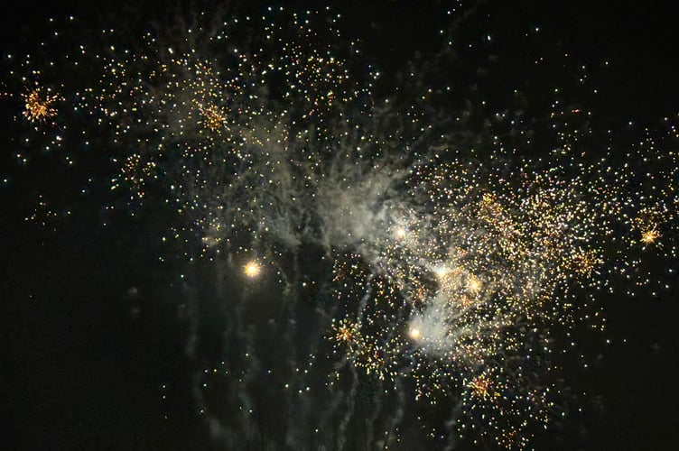 An explosion of golden fireworks over Crediton. AQ 7417