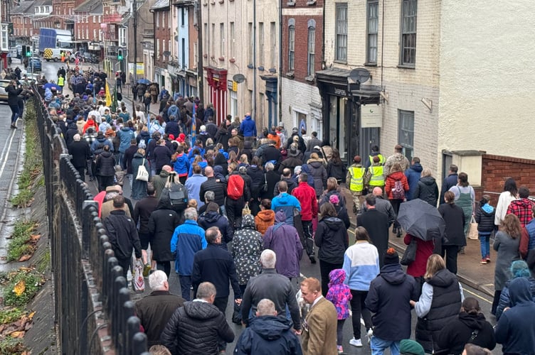 The parade making its way along Union Road to the High Street before moving to Crediton Town Square. AQ 7641