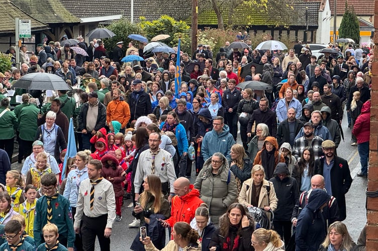 The parade and public move off from the Crediton War Memorial. AQ 7623