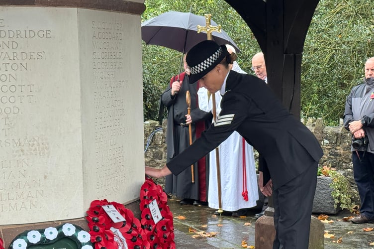 The police wreath being laid at the Crediton War Memorial. AQ 7601