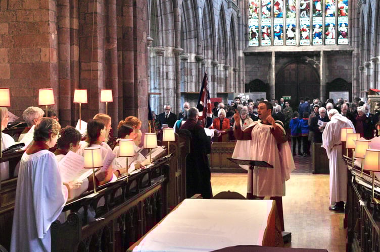 9 November 2025 Remembrance Sunday Holy Cross choir singing during the service (Will Goddard, Crediton Courier)