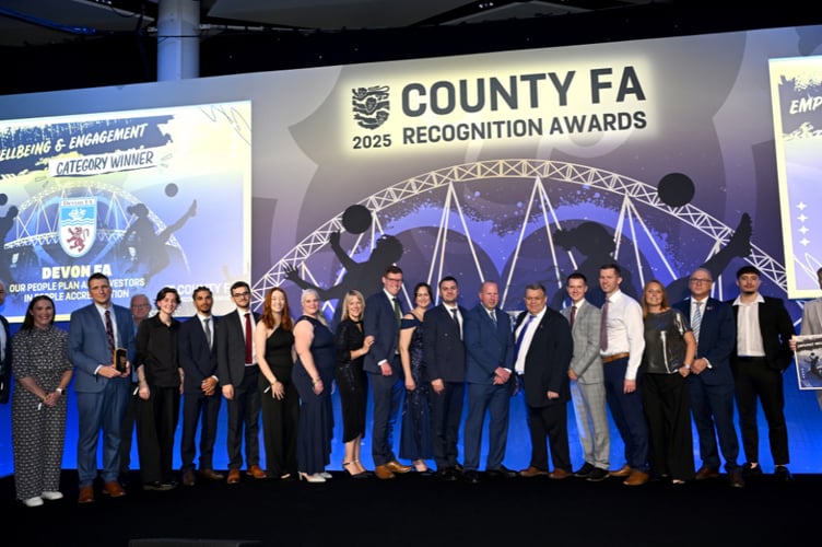 The Devon FA staff receiving the Employee Wellbeing and Engagement Award at the 2025 County FA Recognition Awards at Wembley Stadium.
