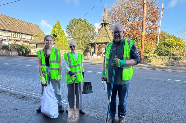 CUT volunteers Charlotte, Rachel and Tim who cleaned up the area near the Crediton War Memorial on Saturday, November 8. AQ 7444