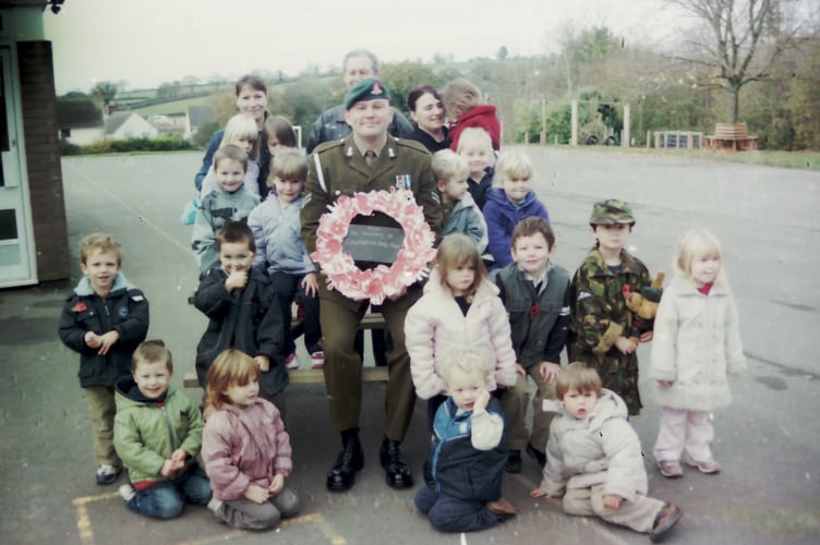 Busy Bees Pre-School at Copplestone made their own wreath of Remembrance, which was placed on the war memorial by Bombadier Brockway from the Royal Artillery in November 2004. DSC02945