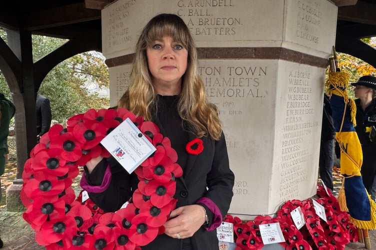 The Vice Chair of Mid Devon District Council, Councillor Sandy Chenore, with the wreath she laid at the Crediton War Memorial. AQ 7791