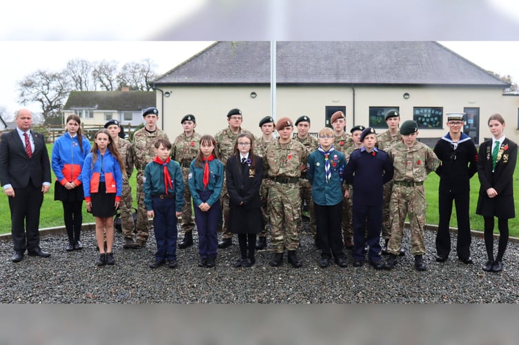 Cadets, scouts and others at Chulmleigh College with Head Girl Agnes Catling and Deputy Head Boy Daniel Rhodes, far right, and Hope Russell, front, fourth from left