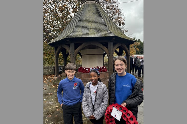 Three Landscore Primary School Ambassadors who marked Armistice Day at Crediton War Memorial.