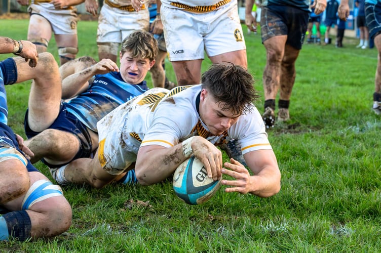 Luke Jones forged a path through Tiverton defenders to score for the 1st XV