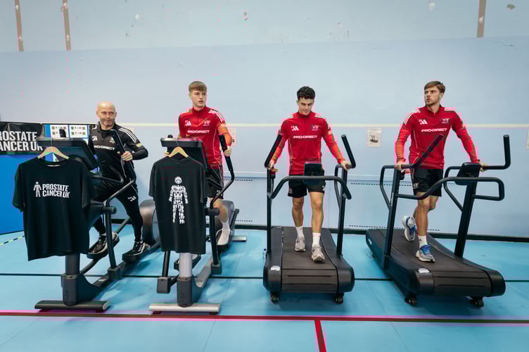 Staff and players from Exeter City Football Club and officers from HMP Exeter joined forces to raise funds for Prostate Cancer UK.
