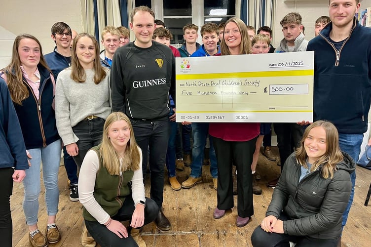 Bow YFC members present a cheque for £500 to a representative from North Devon Deaf Children’s Society.
