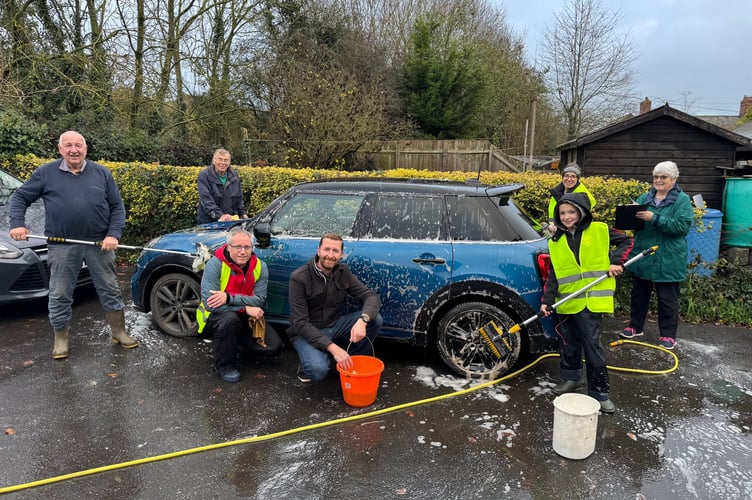 Volunteers cleaning cars in aid of Children in Need at Copplestone Church. AQ 8079