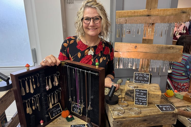 Rachel Vowles of Sandford makes spoon rings, earrings and trinkets and was busy selling items at Sandford Craft Fair.  AQ 8067
