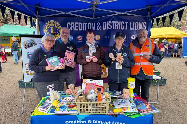 The Lions Club members with some of the items collected for Ukrainian children at Crediton Farmers’ Market. AQ 7974