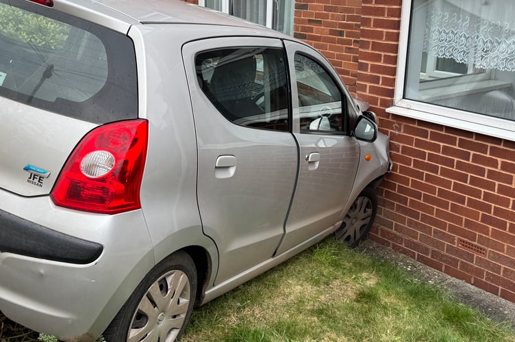 The car which came to rest on a Spruce Park house in Crediton.  AQ 8296
