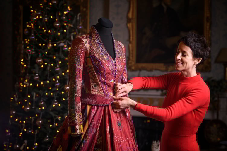 This sensational red dress, with Somerset creator Kirstie Macleod, is on display at Christmas at NT Killerton House, near Exeter, from Saturday, November 29. The red dress is a record-breaking embroidered dress, stitched by 380 people from 51 countries. Picture by Steve Haywood.