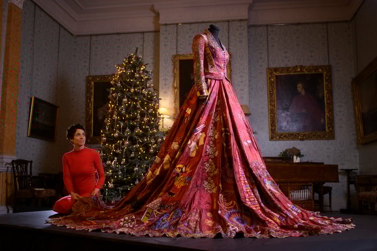 This sensational red dress, with Somerset creator Kirstie Macleod, is on display at Christmas at NT Killerton House, near Exeter, from Saturday, November 29. The red dress is a record-breaking embroidered dress, stitched by 380 people from 51 countries.