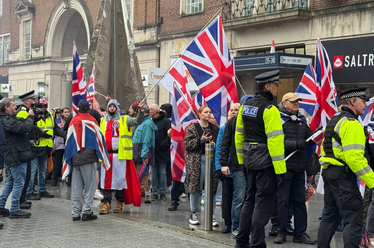 British Unity Walk members walked up the High Street but were kept to the pavement for much of it by police. AQ 8797