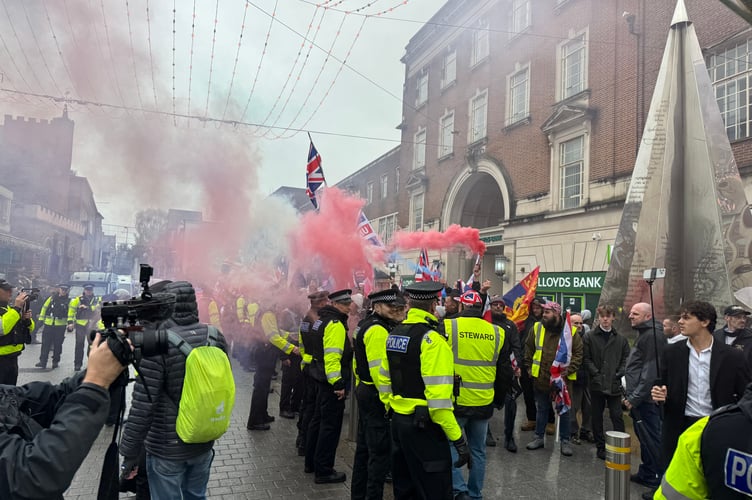 Red, white and blue flares were let off by British Unity March protesters upon arrival at Bedford Square. AQ 8779