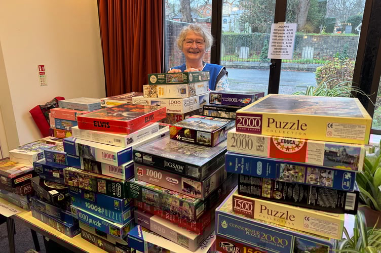 Kathleen Hughes can just be seen behind the Great Wall of Jigsaws at the St Nicholas Fair, explaining that she had sold many but the wall never went down!  AQ 8592
