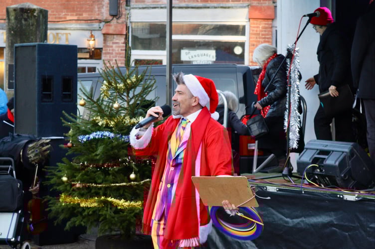 29 November 2025 Christmas lights switch-on Rob Pudner was MC for the event (Will Goddard, Crediton Courier)