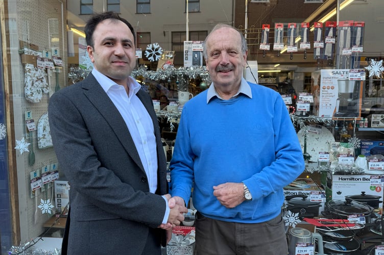 David Adams, right, has sold Adams Home Hardware to Mustafa Khan from Exeter.  AQ 8489

