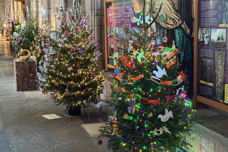 One of the avenues of decorated Christmas trees in Crediton Parish Church. AQ 9850