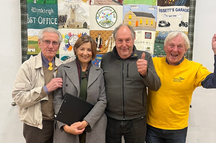 Steve Middleton celebrates topping the poll in the Winkleigh by-election, with Councillor Teresa Tinsley and campaigners Ray Morgan (left) and Stephen Potts (right).
