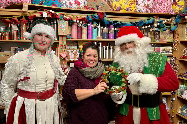Laura Kemp of The Green House, centre, had a visit from Santa Claus
