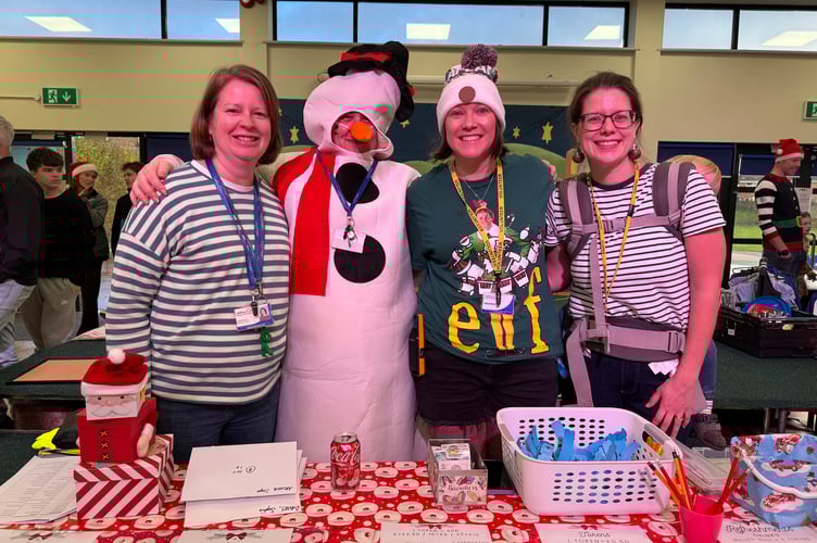 Organisers and helpers sold many tokens at Landscore Primary School Christmas Cracker. AQ 0119