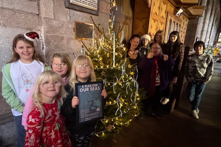 The Home Group at The Nest made handmade starfish and jellyfish and wrote a poem for their environment themed message on their tree.  AQ 9774

