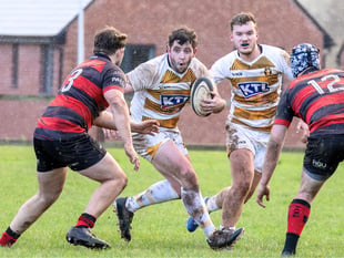 Firsts edge out Cullompton in driving rain