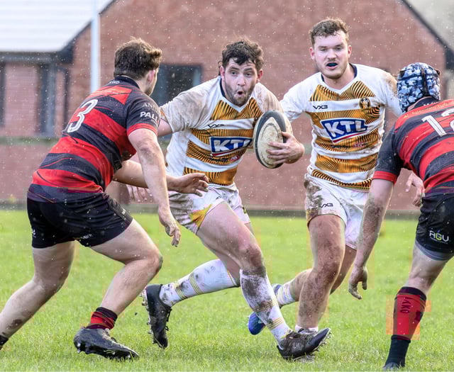 Firsts edge out Cullompton in driving rain