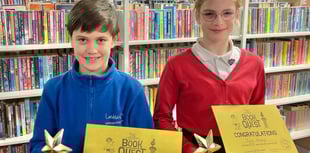 Trophies for pair who read 500 books in library challenge