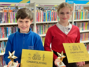 Trophies for pair who read 500 books in library challenge