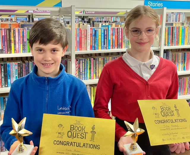 Trophies for pair who read 500 books in library challenge
