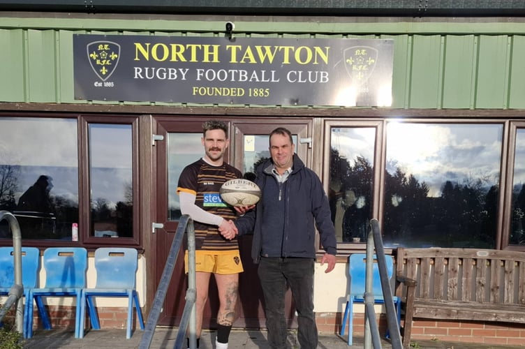 Ryan Gross, North Tawton RFC captain receives the match ball from sponsor and past player Rob Campbell.
