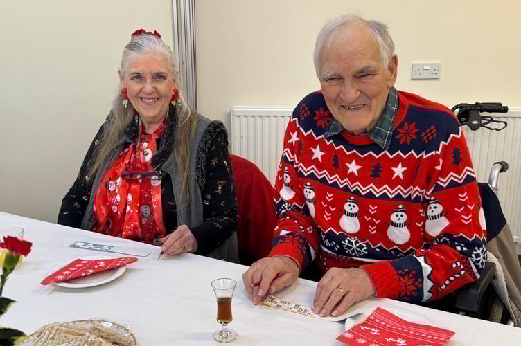 Colourful Christmas for two guests at the Senior Citizens Christmas Tea Party. AQ 0523