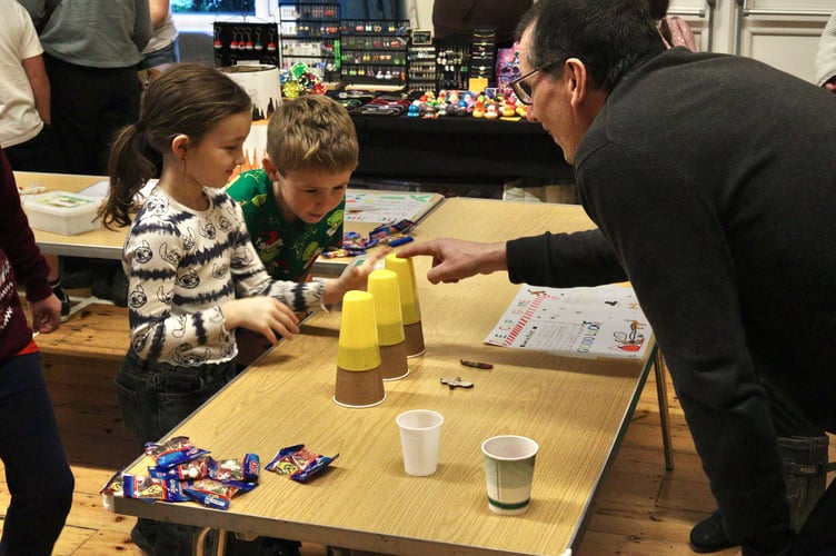 Playing 'The Cup Game' at the Spreyton Christmas fair