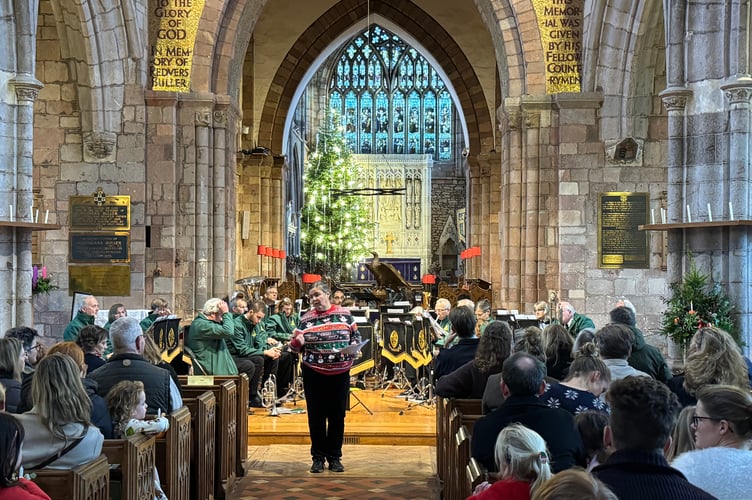 Antonia Tregenza led the Christingle service at which Crediton Town Band played.  AQ 0673
