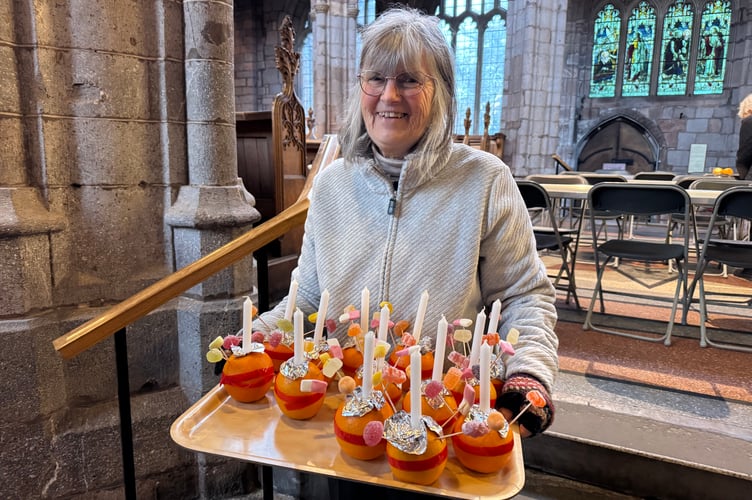 Liz Brookes-Hocking with spare Christingles.  AQ 0672
