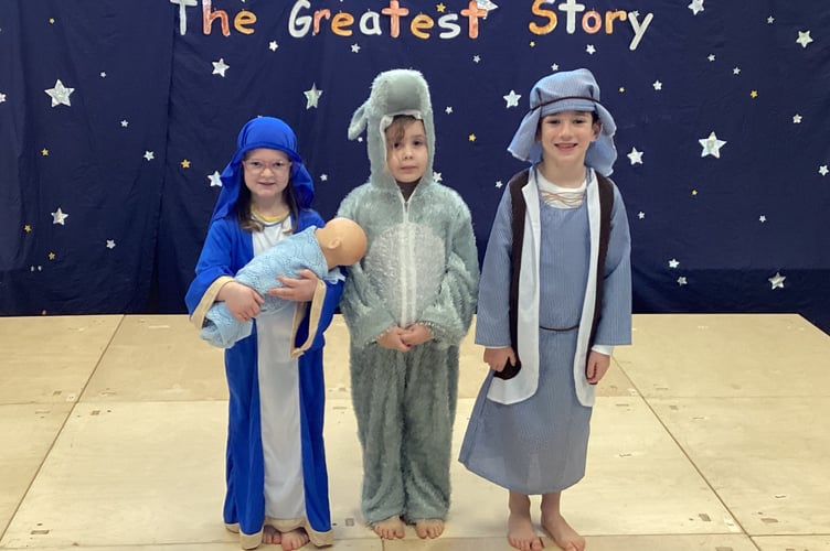 Mary with the baby Jesus, Joseph and a donkey from Tedburn St Mary Primary School.
