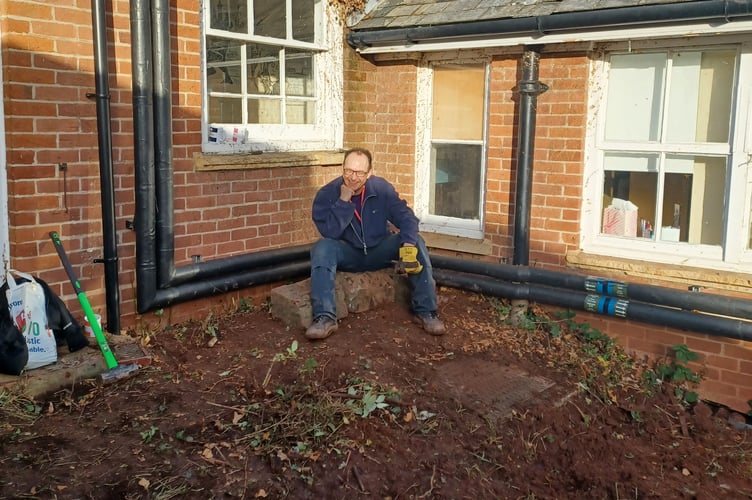 Taking a break during the voluntary work at QE School.
